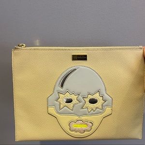 Stella McCartney clutch. Sand color. Graphic detail on front.